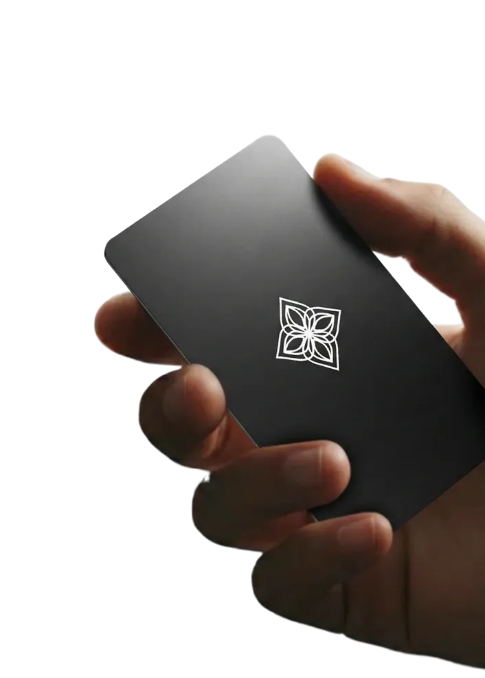 A hand holding the matte black Bloom Card