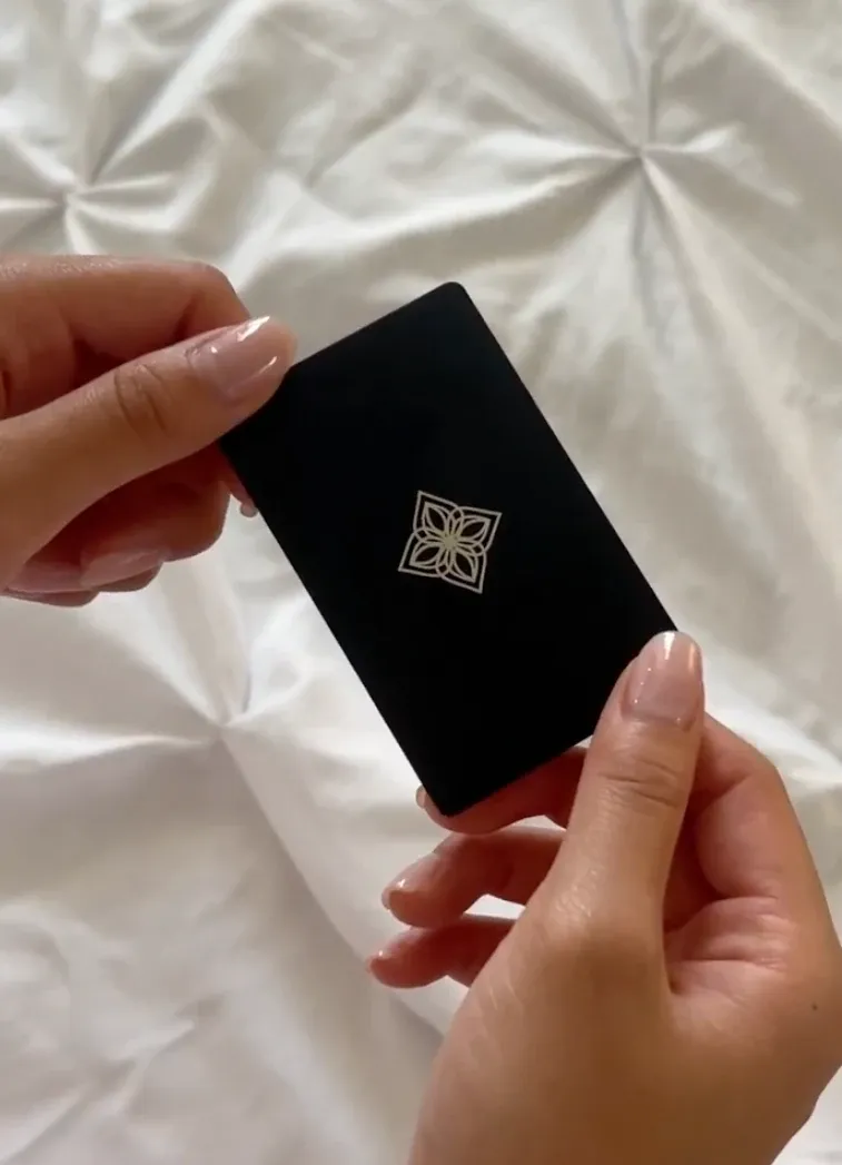 Jacie holding her Bloom Card